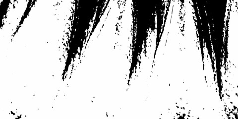 Abstract black brushstrokes and splatters against a stark white background