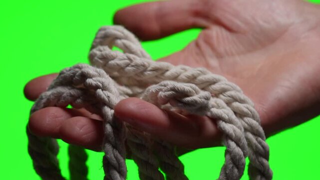 A rope with a knot at the end.
A strong white rope on an isolated background.