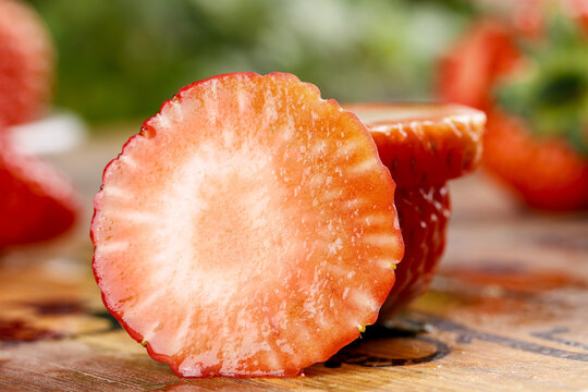 Fresh Dandong Strawberry Cut in Half with Milk - Healthy Fruit and Vitamins Nutrition Concept
