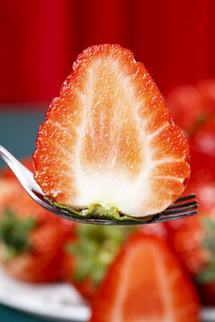 Fresh Strawberry Slice with Milk Cream on Fork - Rich Vitamins and Refreshing Fruit Still Life