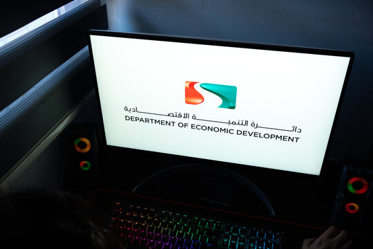 Punta Arenas, Chile &ndash; March 07, 2026: A desktop PC monitor showing the official Department of Economic Development wordmark in a dark room with a backlit gaming keyboard