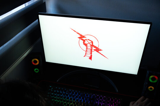 Punta Arenas, Chile &ndash; March 07, 2026: Red CM Punk professional wrestling fist and lightning bolt logo displayed on a bright computer monitor screen