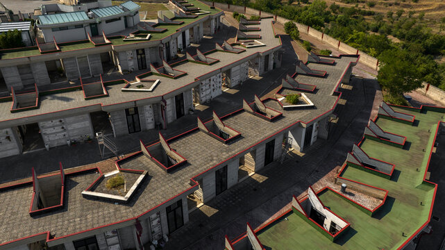 Aerial closeup of a modern monumental cemetery with tiered burial sections.