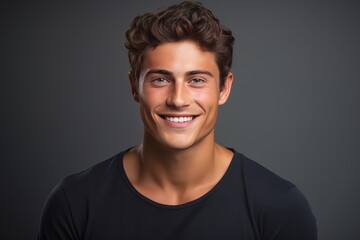 Obraz premium Young man smiling with healthy white teeth and showing self confidence