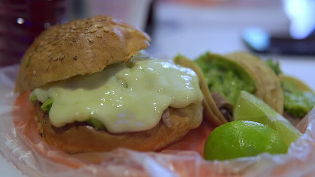 Delicious mexican cemita sandwich with melted cheese and lime