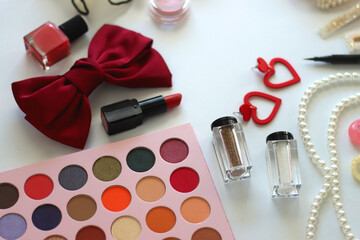 Various accessories and beauty products on white background. Coquette aesthetic. Selective focus.
