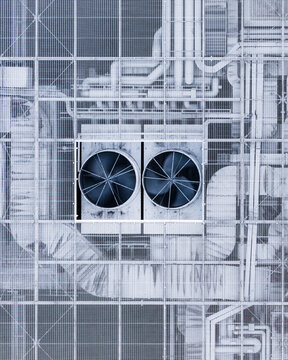 Aerial view of cooling towers and a network of pipes creates a complex industrial tapestry, a symphony of steel and functionality, Warsaw, Masovian Voivodeship, Poland.