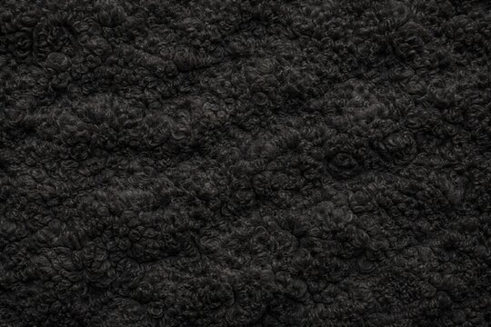 Black Sheep Wool Fur Texture Seamless Pattern. Close-up black sheep fleece detail. Farm animal wool surface design. Realistic sheep fur. Detailed natural wool macro close-up.