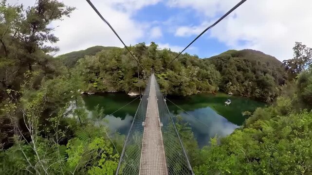 First-person view of ziplining over a lush green forest and river