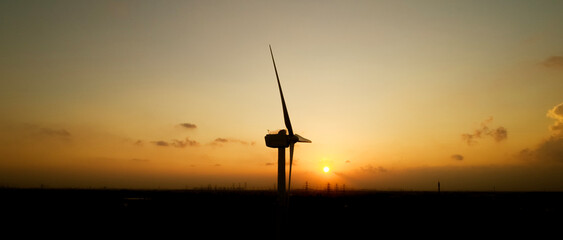 wind turbine at sunset © jeson
