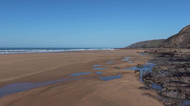 Low tide and spring sunshine at Sandymouth Bay Cornwall