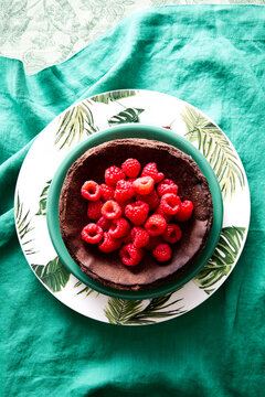 Chocolate Basque Cheesecake with Fresh Raspberries on Green Linen