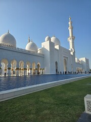 Sheikh Zayed Grand Mosque with white marble architecture and reflection pool