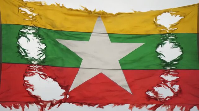 Myanmar National Flag Tattered with Holes Representing Conflict and Struggle