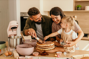 Family baking cake creating sweet joyful memories