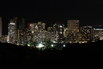 Obraz premium Honolulu Waikiki skyline at night with illuminated high-rise buildings Hawaii 