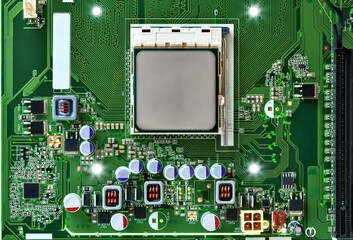 Close-up of a modern motherboard featuring a central CPU socket surrounded by electronic components, metallic capacitors, and detailed PCB traces. Clean, technical composition ideal for engineering, h