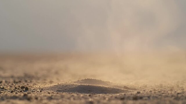 Dust devil forming in arid environment with dramatic lighting and texture