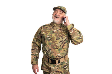 Elderly military man wearing camouflage uniform and cap, smiling and laughing while talking on a...