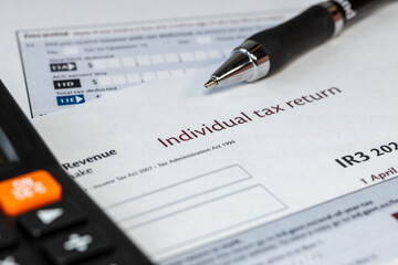 New Zealand tax settlement. Tax forms. NZD dollar money wallet. Financial business concept. Filling out a form. Close up