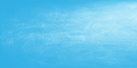 Obraz premium A blue grunge abstract background features a frozen water surface texture with white winter frost and ice patterns under a cold sky for a fresh nature wallpaper backdrop