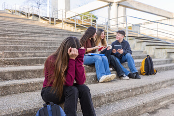 Fototapeta premium Sad teenage girl feeling excluded from her schoolmates