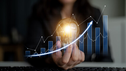 A business professional holds a light bulb symbolizing innovation while data graphs illustrate growth and success, highlighting the importance of analytics in the corporate landscape. Scalp © InfiniteFlow