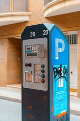 Badalona, Spain-September 11, 2022. Parking meter is a device located on public roads. Its function is to collect money in exchange for the right to park a vehicle in a public place,