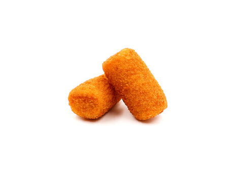 Two homemade potato croquettes isolated on a white background.