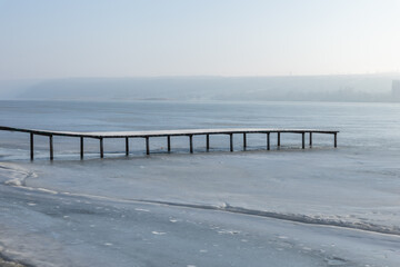 Misty Rural Landscape in the Republic of Moldova at the End of Winter, Foggy Countryside with Bare Trees, Agricultural Fields and Peaceful Village Atmosphere in Eastern Europe.