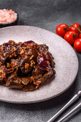 Fototapeta premium Chicken, duck, or goose liver with plums, onions, and spices. Chicken liver