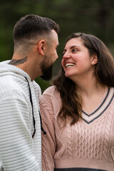 Obraz premium Happy young couple sharing a cheerful moment laughing