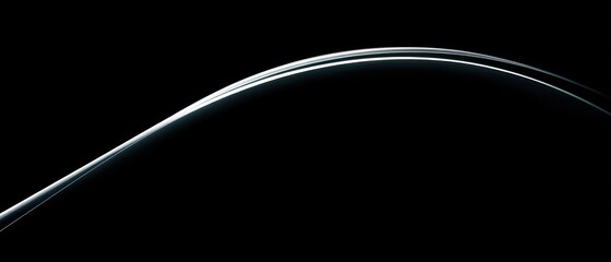 Fototapeta premium Abstract curved lines against a black background graphic art design element