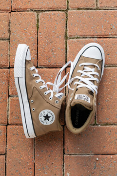Converse All Star shoes product photo on brick floor casual fashion