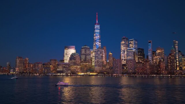 NYC glowing at night. New York skyscrapers at night, NYC. New York downtown. New York with famous skyscrapers, NYC from drone. New York Manhattan panorama with towers at night.