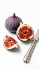 Purple figs sliced open with vintage knife on clean white background minimal setup