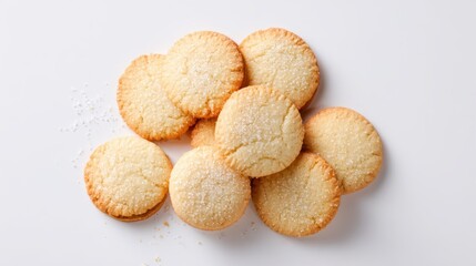 Minimalist top-view of baked butter cookies with sugar on white background