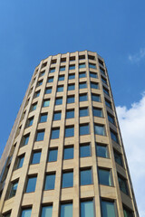 Fototapeta premium modern glass and concrete buildings against the sky, copy space