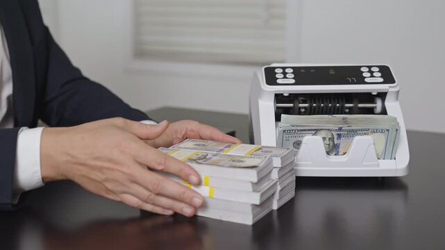 Counting dollars. Hand and money counter. management in office. Investment concept. Finance managers hands with counting machine. Finance success. Financial transactions.