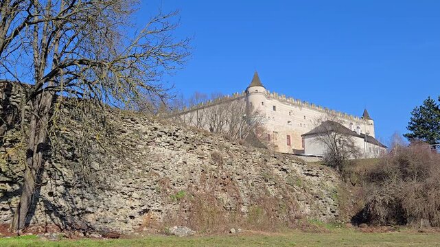 Medieval fortress wall of Zvolen Castle with trees