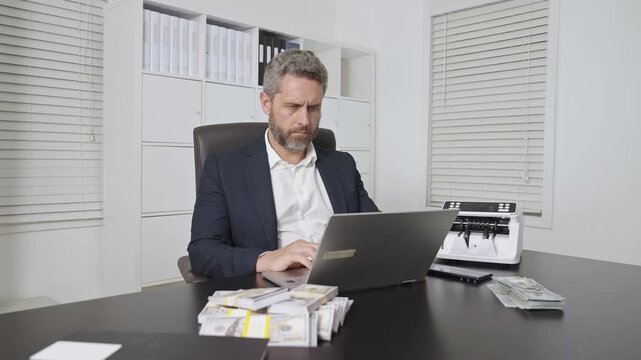 Businessman at office desk with money counting machine. Finance expert. Financial control. Money operation in bank office. Business man in money counting process. Banker and currency.