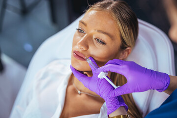 Young Woman Receiving Lip Filler Injection for Fuller Lips in Modern Cosmetic Clinic