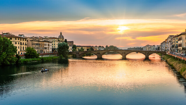 Ponte all Carraia at sunset, spanning Arno River, in Florence, Italy