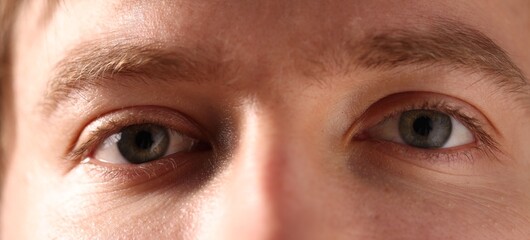 Fototapeta premium Macro view of young man with beautiful eyes