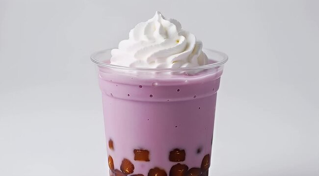 Delicious taro bubble tea with whipped cream on a bright white background