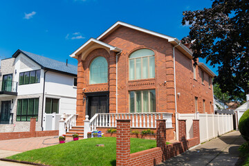 Fototapeta premium Property in neighborhood. Residential property house. Residence architecture. Suburban neighborhood. Suburban house architecture. Private house. Neighborhood architecture. Cozy building