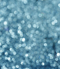 Obraz premium Blue glitter bokeh background with sparkling light circles