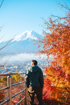 Traveler discovering Mount Fuji viewpoint in autumn