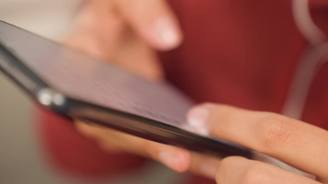 Hands finalize purchase. Customer finishes checkout process with secure digital payment confirmation. Closeup of user finalizing order on mobile device with secure payment and receipt display