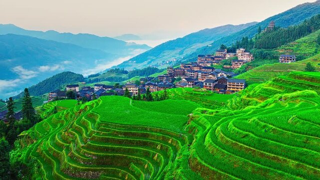 Aerial view of the spectacular Longji Rice Terraces and ethnic village landscape in Guilin, China.